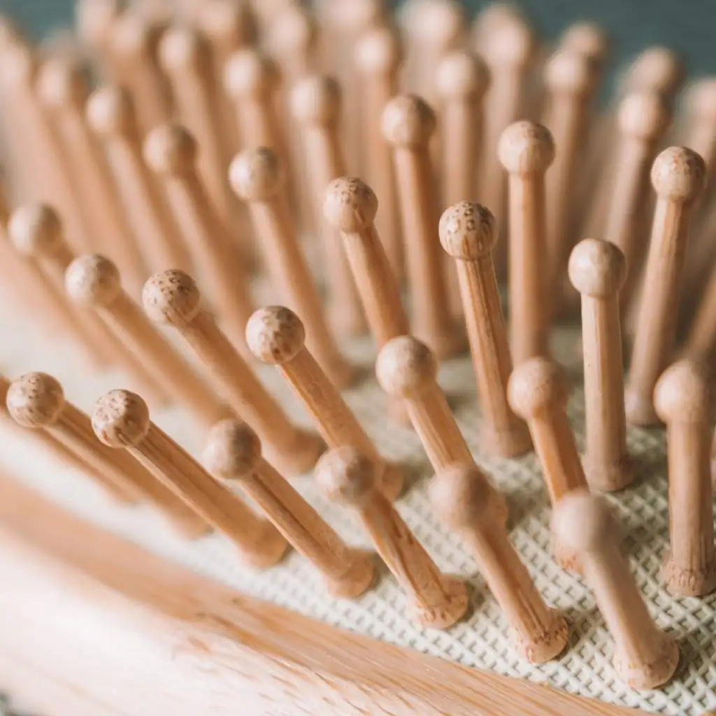 A close-up image of the bamboo brush emphasizing the eco-friendly aspect of the product.